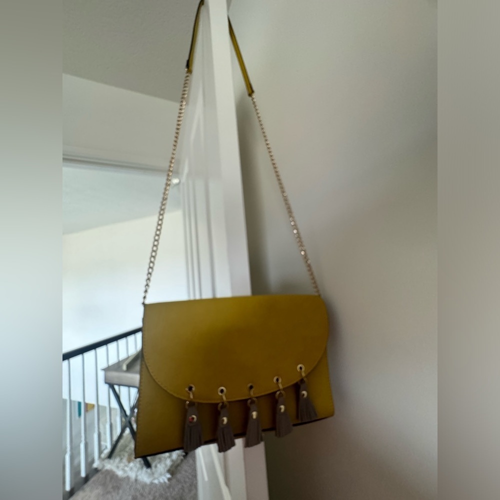 Neiman marcus mustard purse with pin tassels